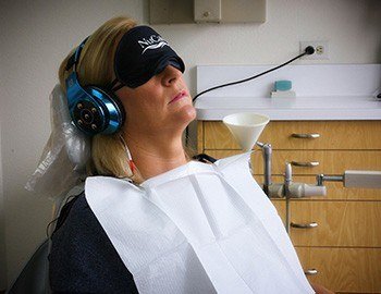 Patient with NuCalm face mask and headphones